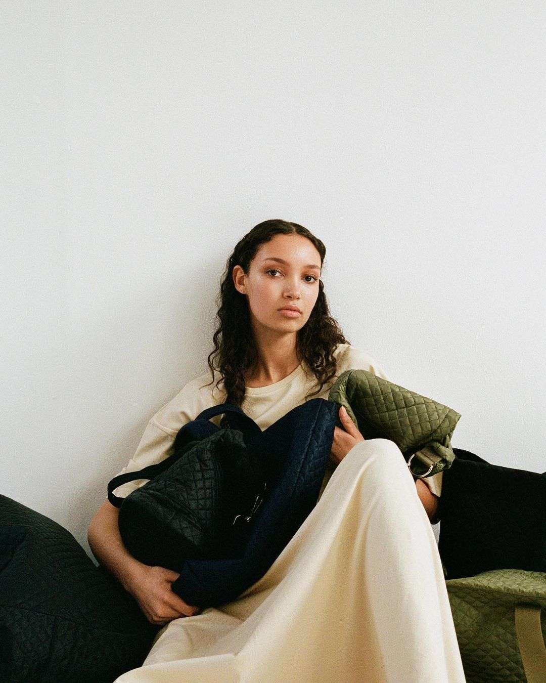girl surrounded by ASK Scandinavia bags