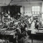 historic photo from a production site with women making clothes
