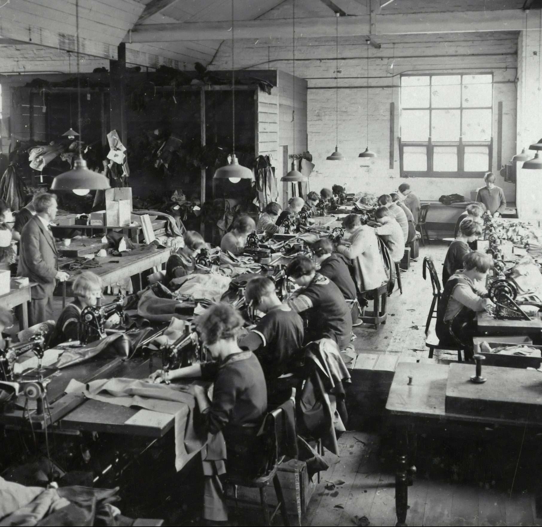 historic photo from a production site with women making clothes
