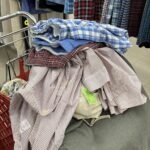 second hand clothing in a cart