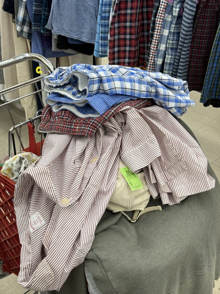 second hand clothing in a cart