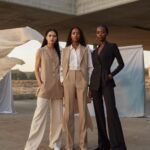 three inclusive AI models wearing suits